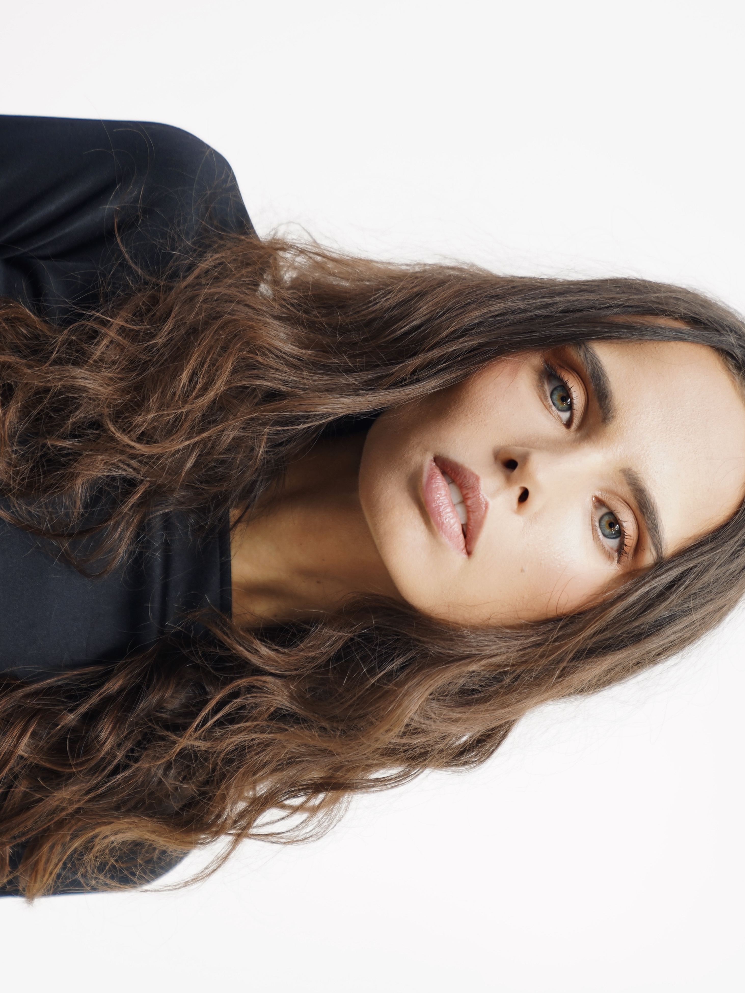 Beauty portrait with long wavy hair and natural makeup