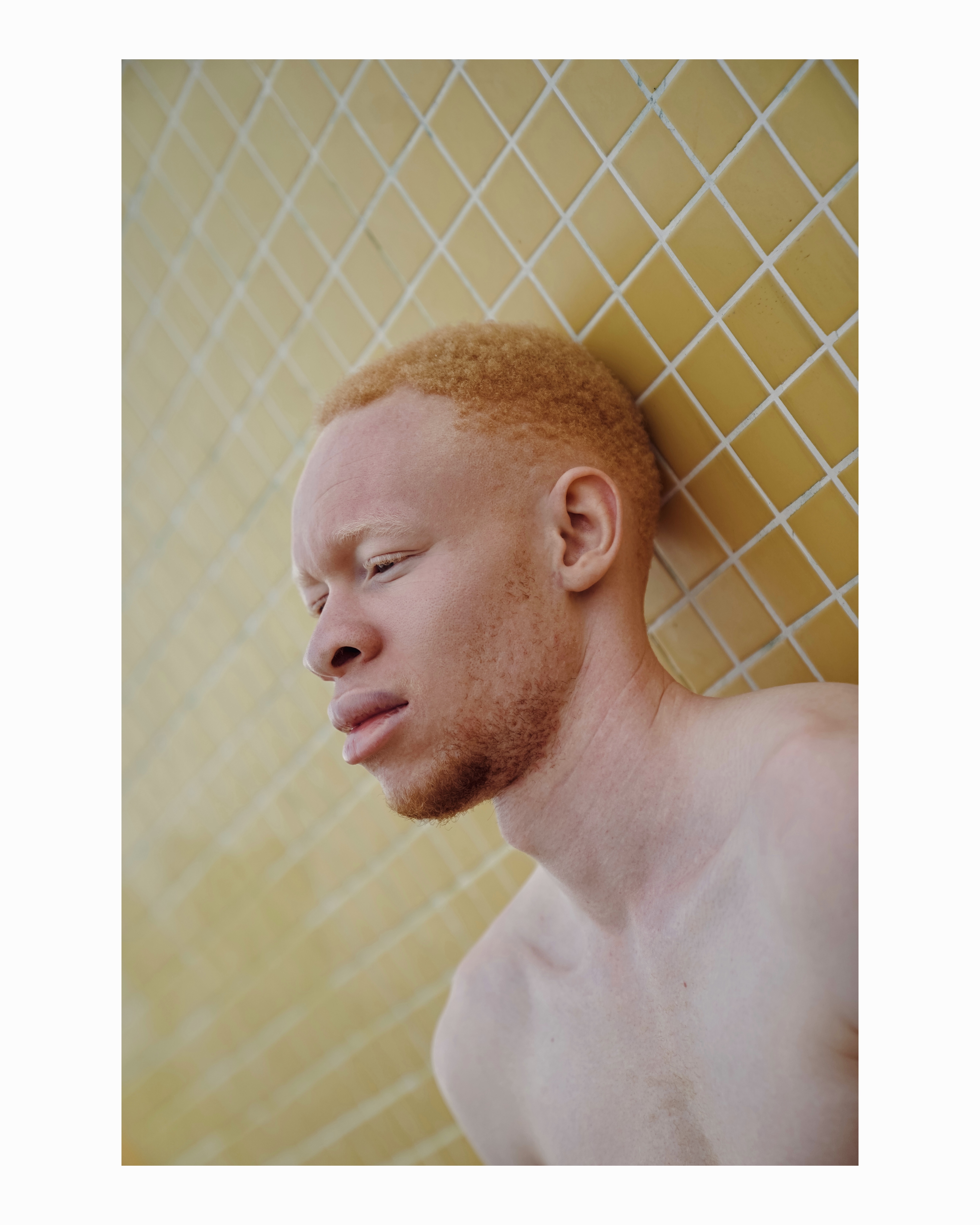 Portrait against golden tiled background
